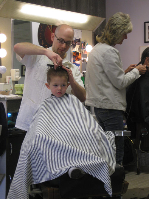 Barbershop owner and his son